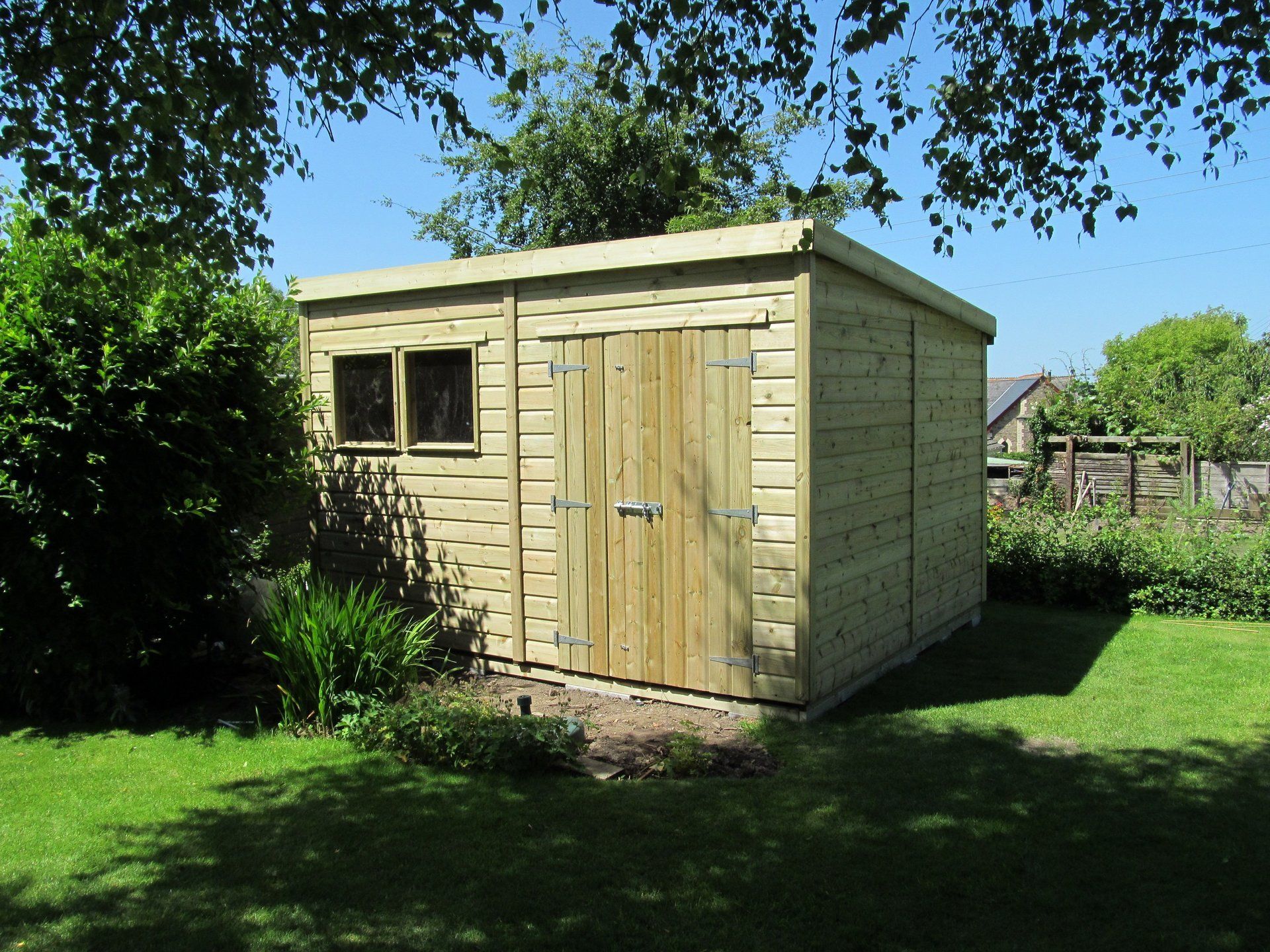 Garden Pent Workshop shed with large door and double windows to the side
