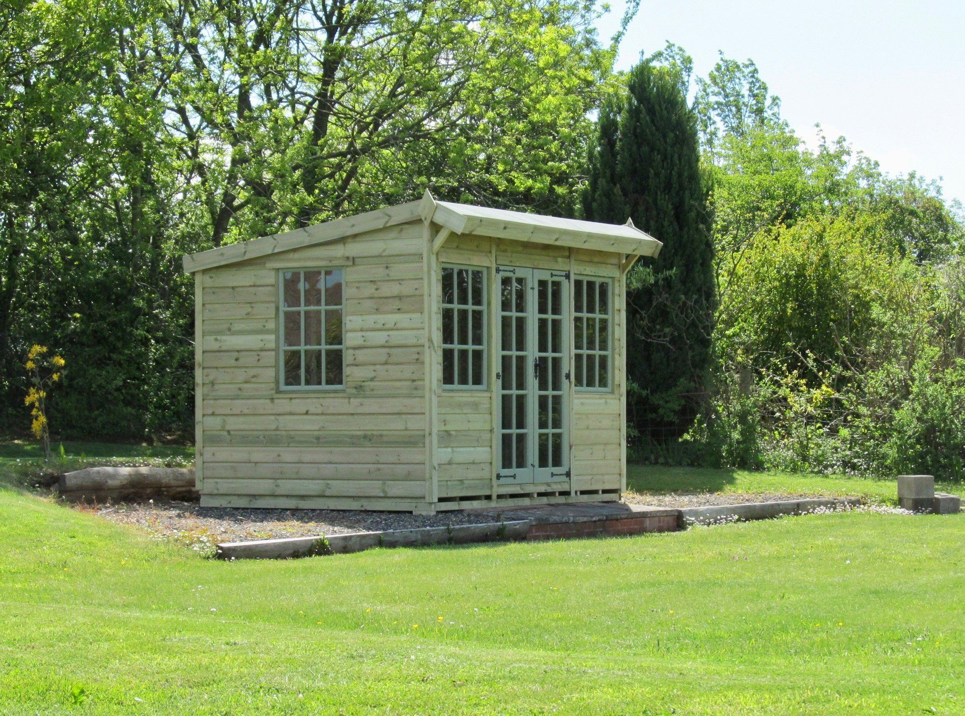 The Ashton Summerhouse in a beautiful garden setting