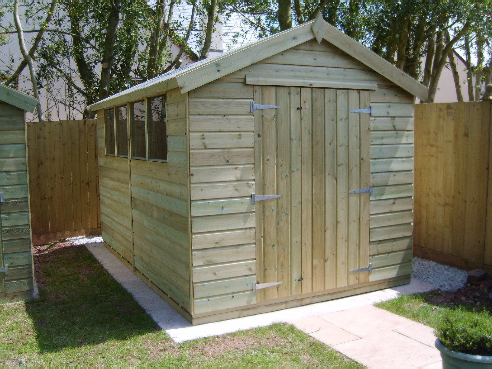 Large apex workshop shed with door to the end and four windows to the side