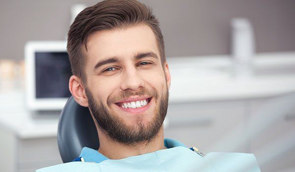 Implant Dentistry — A Man Getting His Teeth Checked in Bala Cynwyd, PA Implant Dentistry — A Man Getting His Teeth Checked in Bala Cynwyd, PA