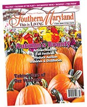A magazine cover with pumpkins and flowers on it.