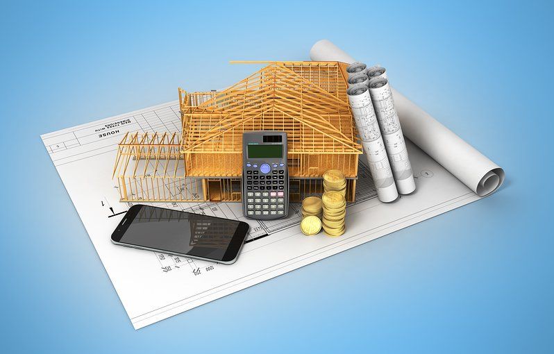 Home construction plans, smart phonee, calculator and wood framee model