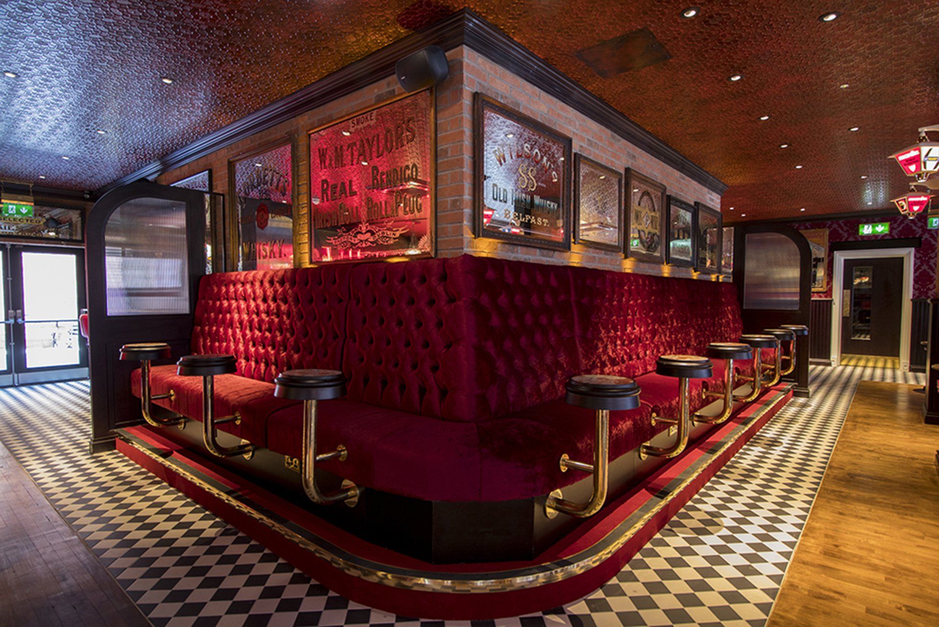 Harp Bar red velvet sofa and attached mini circle table