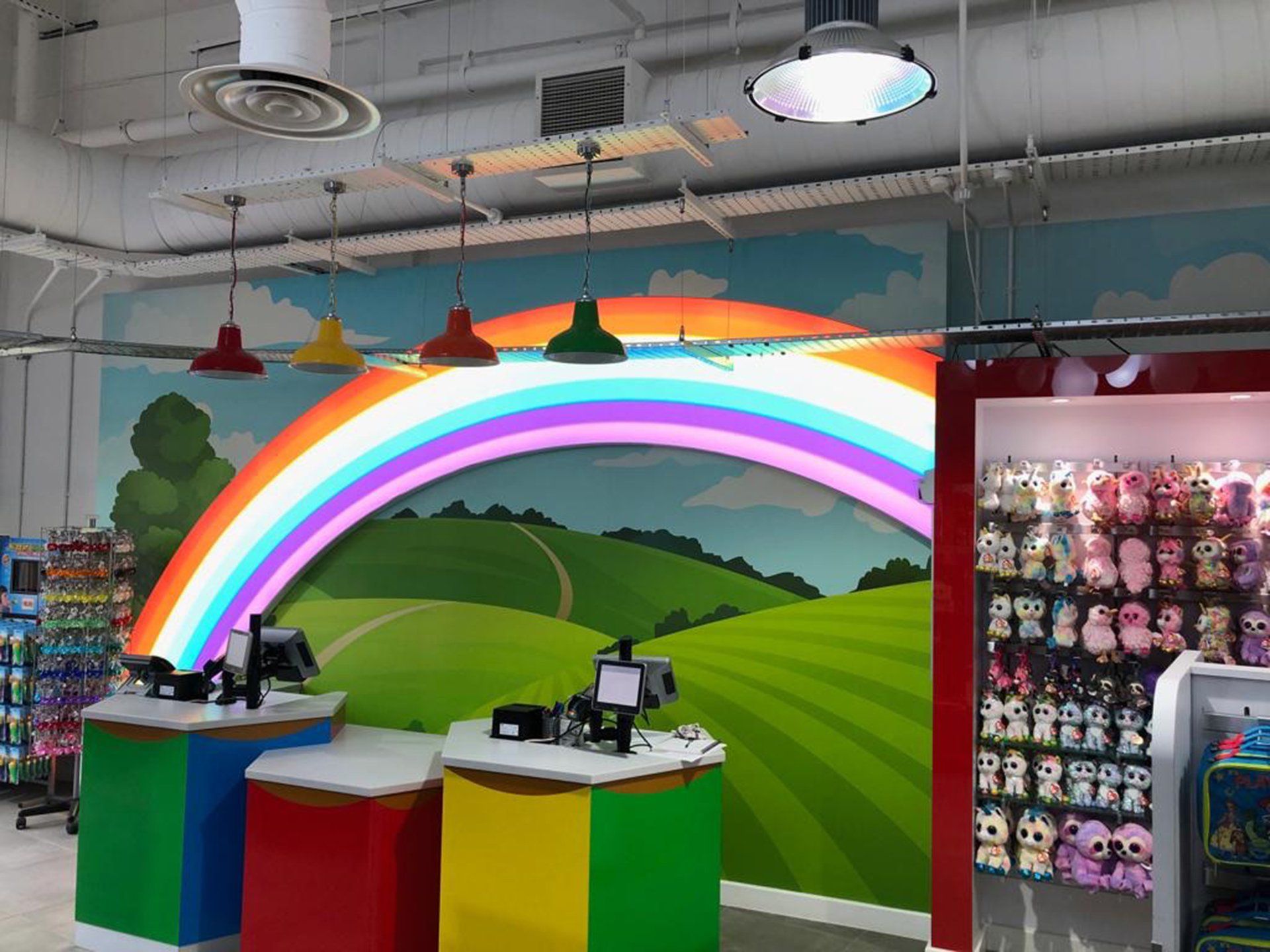 Centre Parc Ireland toy store with a rainbow design on the wall