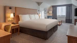 bedroom with lamp shade, and clean beddings