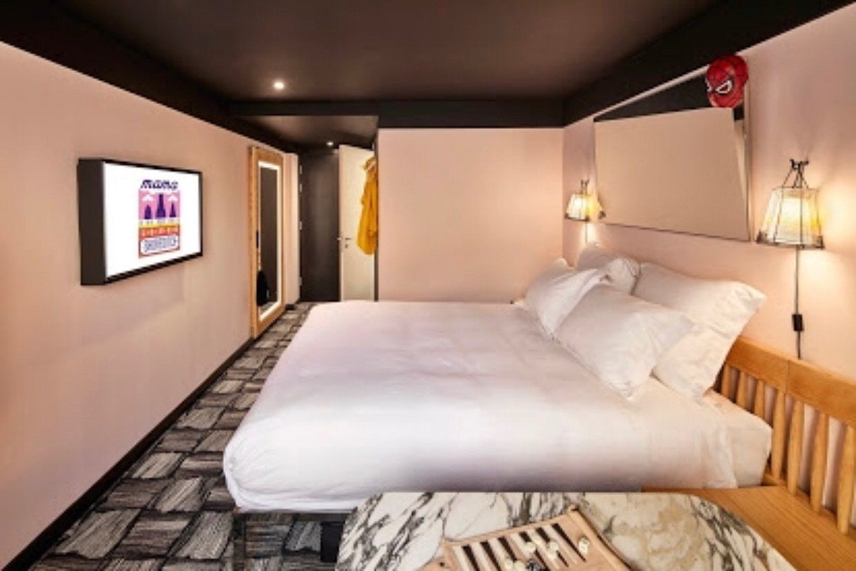 King size bed with fixed television on the wall