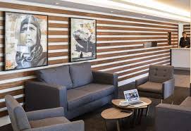 picture on the wall, dark gray sofa and centre table