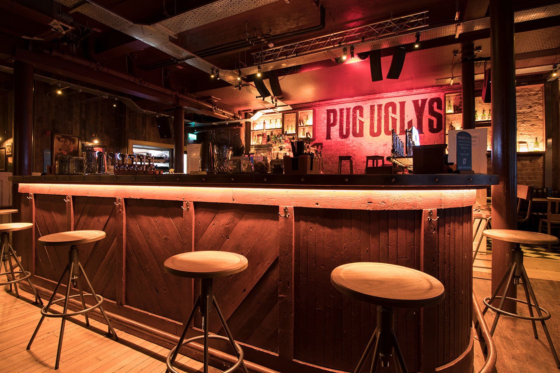 Pug Ugly’s bar, chairs on the lane of bartender's area