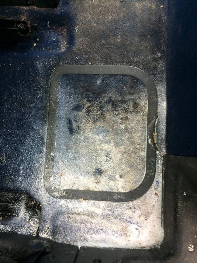 Very dirty dark car floor mat