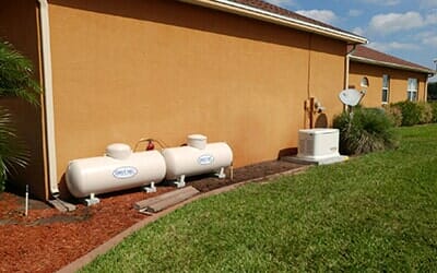Small propane tank connected in a cage — Fuel Company in Sebring, FL Small propane tank connected in a cage — Fuel Company in Sebring, FL