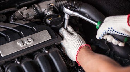 man fixing engine