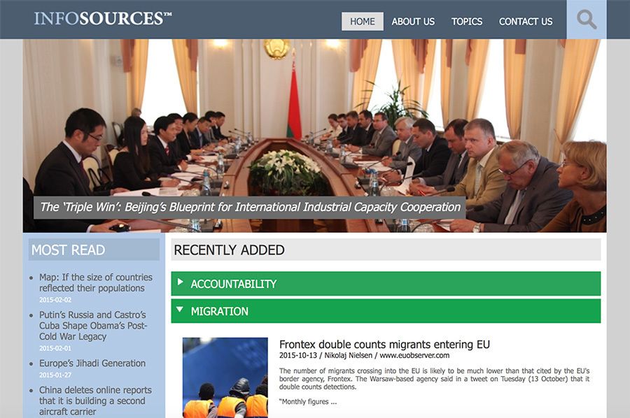 A group of people are sitting around a table on a website called infosources