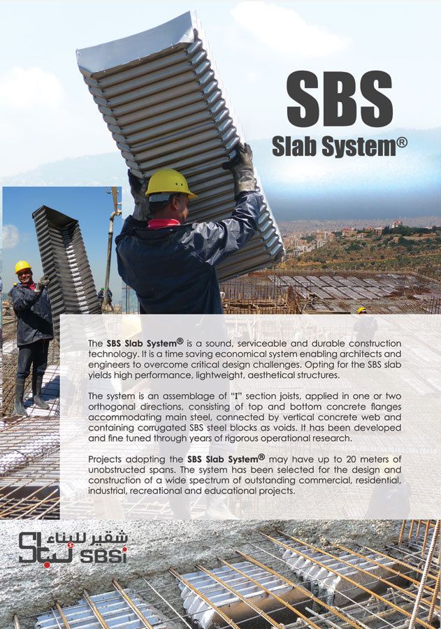 A man is carrying a large piece of concrete on a construction site.