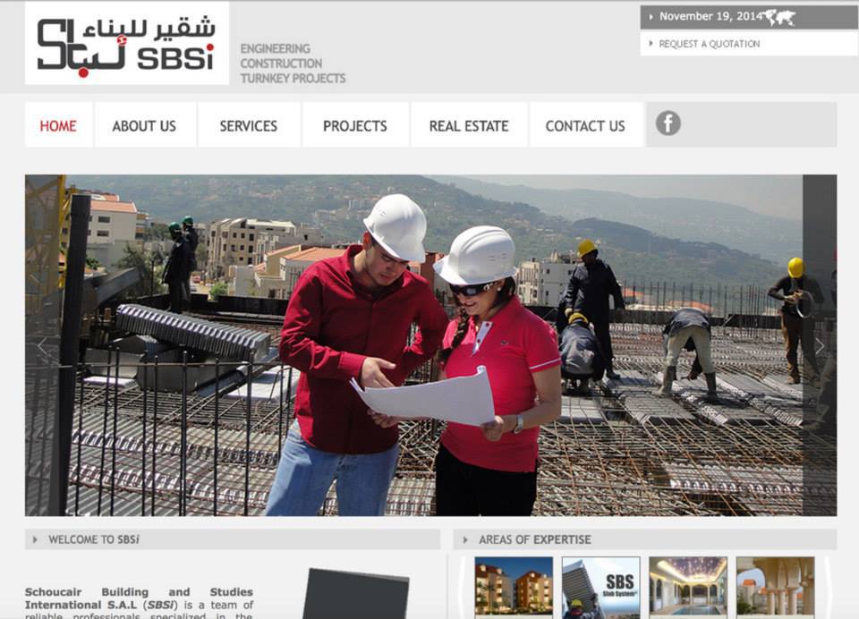 A man and a woman are looking at a blueprint on a construction site