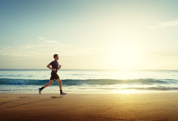 Man Running on Beach — Indianapolis, IN — W R Beach, Inc.