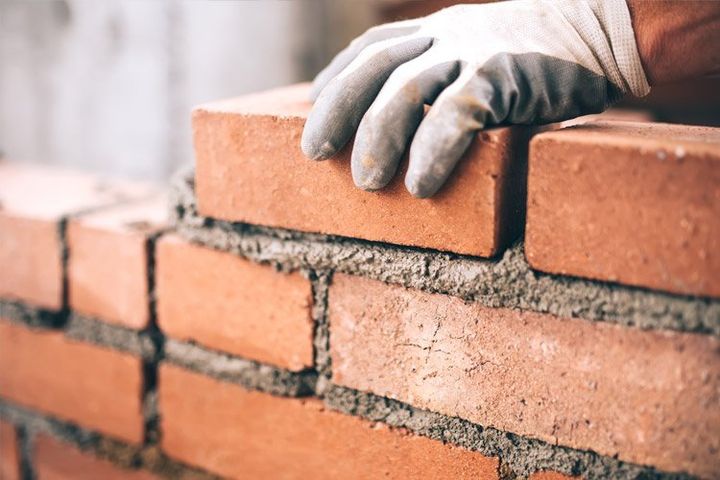 Person Making Brick Fence — Indianapolis, IN — W R Beach, Inc. Person Making Brick Fence — Indianapolis, IN — W R Beach, Inc.