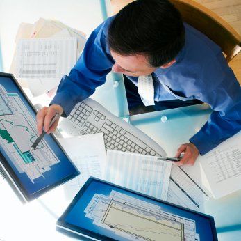 Businessman and Computer at desk. 