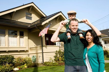 Happy tenants in from of their rental home