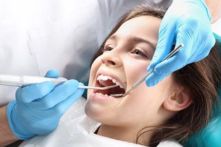 Child in the Dental Chair During Dental Treatment — Spencer, WV — Gentle Dental Care Child in the Dental Chair During Dental Treatment — Spencer, WV — Gentle Dental Care