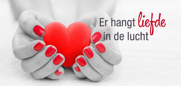 Hands holding a red heart with text 
