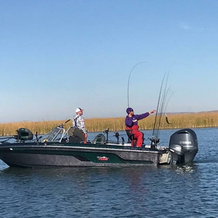 fishing on a lake with a boat kept at Lake Road Storage