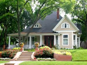 A house with a large porch and stairs leading up to it.