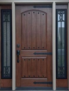 A wooden door with a handle and two windows