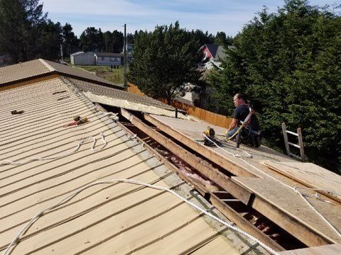 Man Assembling the Roof — Astoria, OR — Northwest Roofing & Construction LLC