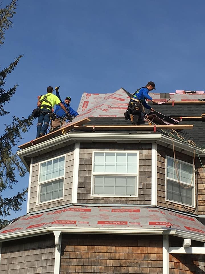 Three Person Standing in the Roof — Astoria, OR — Northwest Roofing & Construction LLC