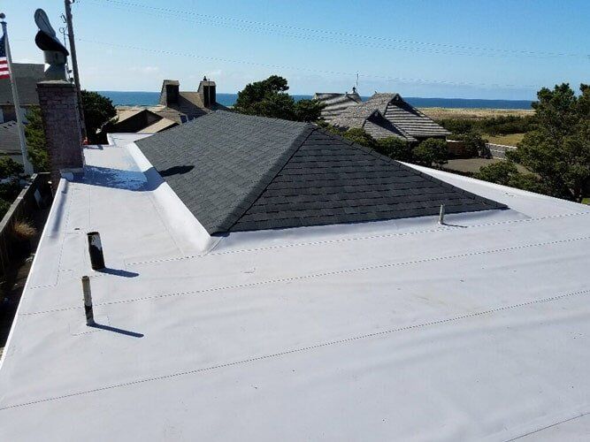 Roof with White Coating — Astoria, OR — Northwest Roofing & Construction LLC