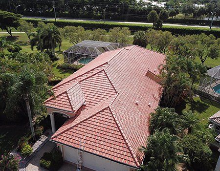 Roofing Contractor — Aerial View of House with Tile Roofing in Miami, FL Roofing Contractor — Aerial View of House with Tile Roofing in Miami, FL