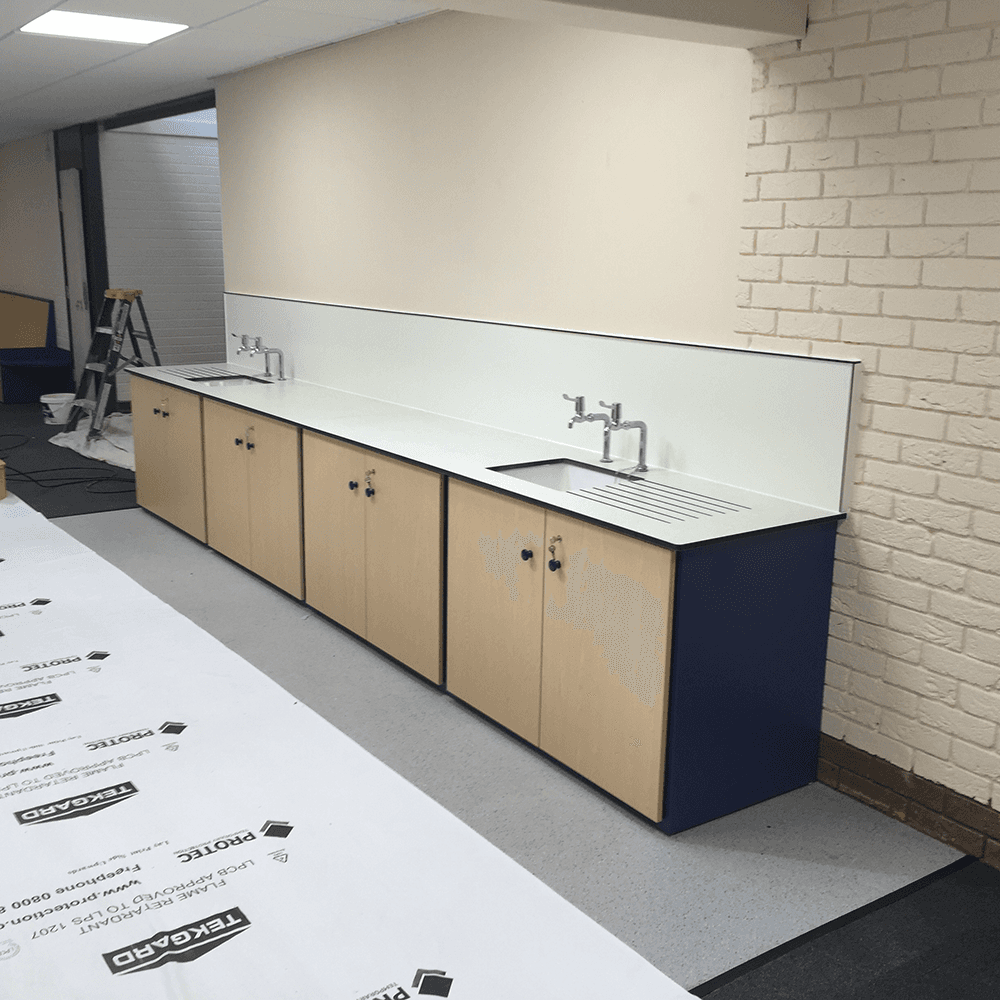 sink installed with wooden storage