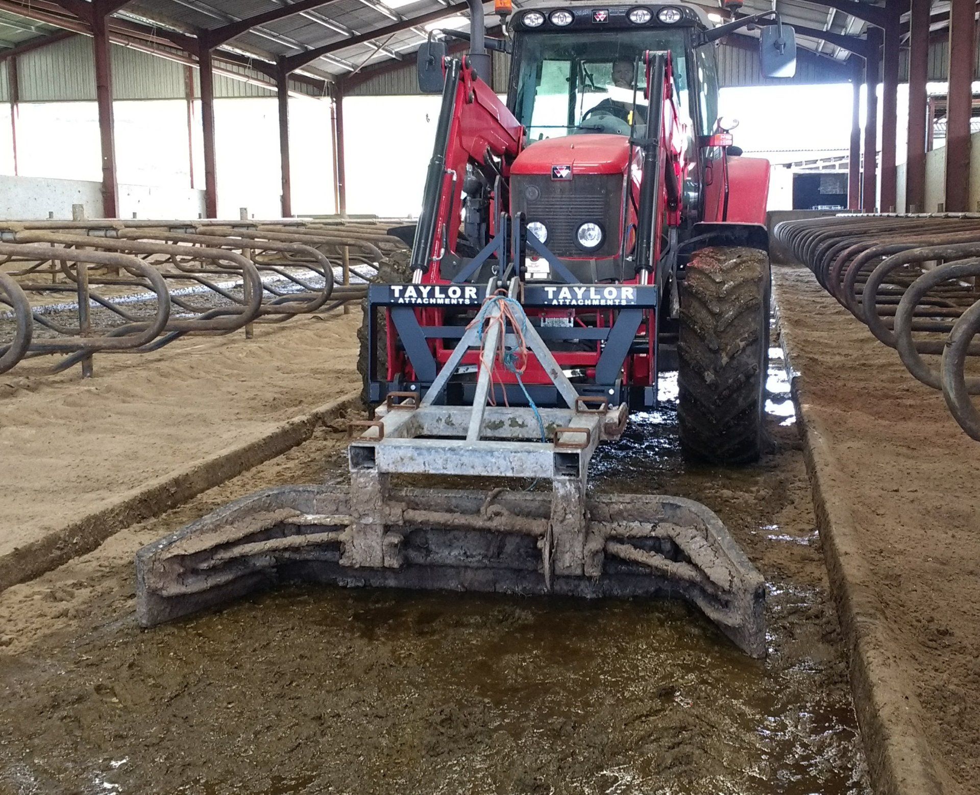 Floating Yard Scraper Headstock Attachment in use on Tractor Loader