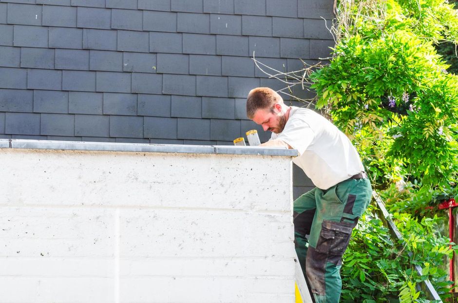 man climbing on the roof