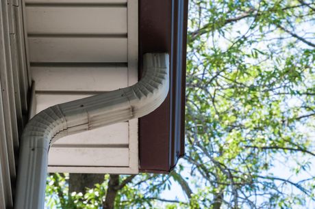 a house with roof gutter pipe