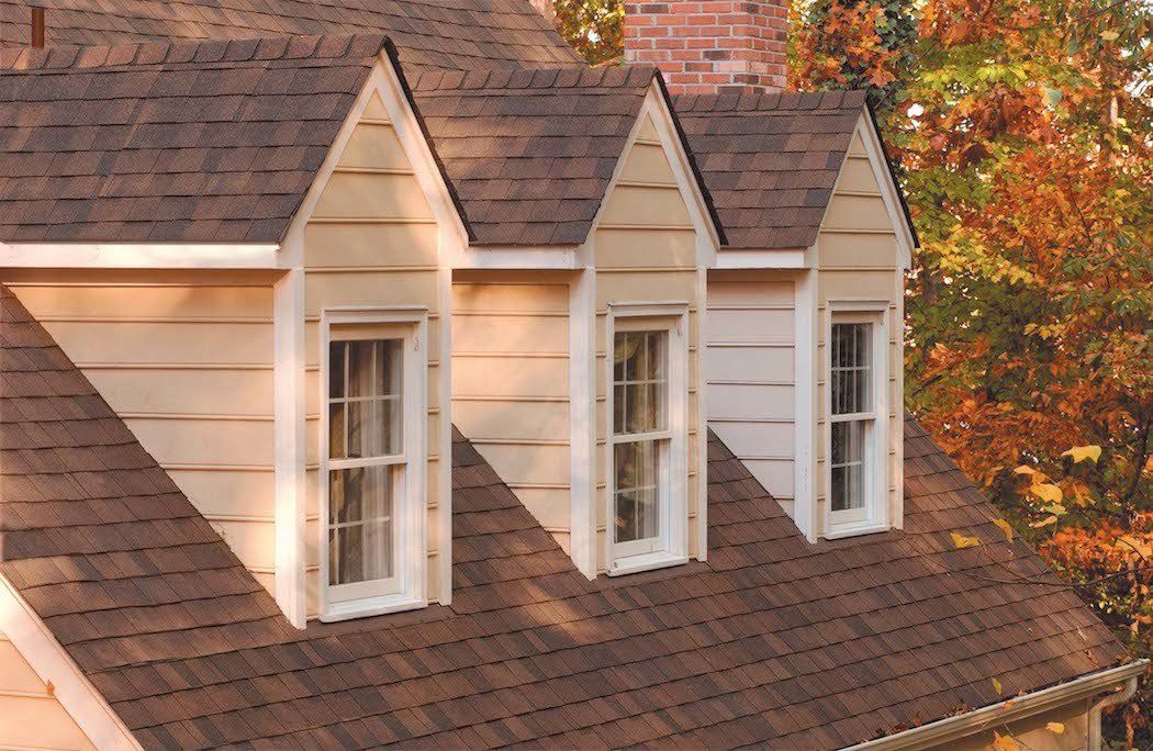 Architectural Shingle - color: Burnt Sienna Roof. Dormers and new vinyl Windows