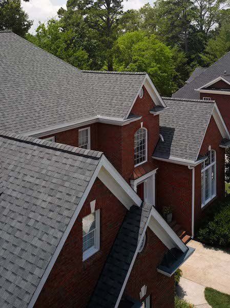 Architectural Asphalt Shingle Residential Roof in Colonial Slate with new White Trim wrap and gutters