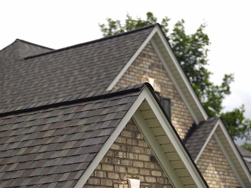Asphalt Architectural Shingle Residential Roof Close up, Landmark in Driftwood with white trim
