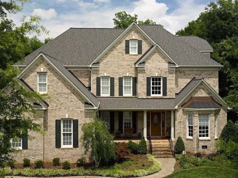 Driftwoood Architectural Asphalt Shingle Residential Roof, Landmark Colonial Slate algae resistant cream colored brick