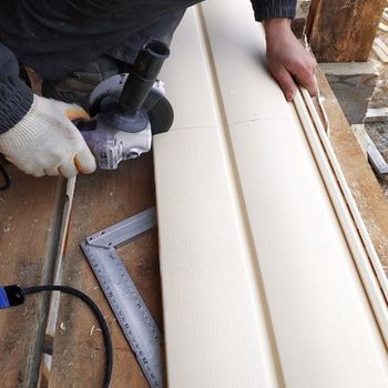 A Man Repairing A Wall Siding — Lee's Summit, MO — Anthony's Painting