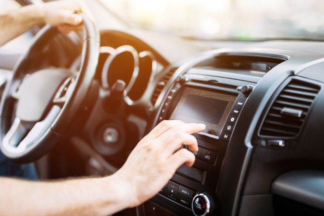 Man Using Navigation System — Lithonia, GA — Martin Tire Co Man Using Navigation System — Lithonia, GA — Martin Tire Co