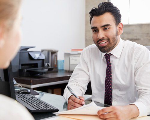 Payroll Service — Professional Accountant in Meeting with Woman in Petersburg, VA Business man speaking with a client