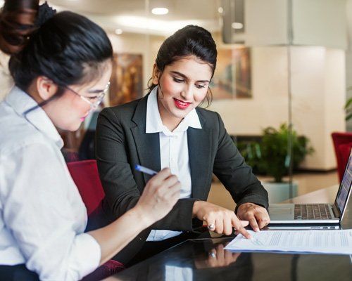 Accountant — Accountant and Client Signing Contract in Petersburg, VA Business women working on their tax's