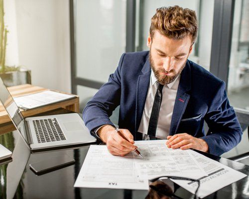 Business man working on tax papers