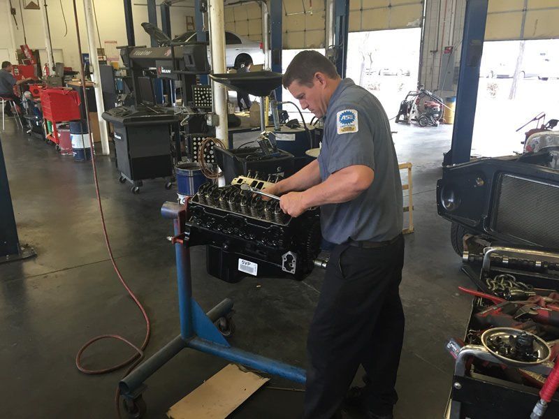 Technician assembling new engine