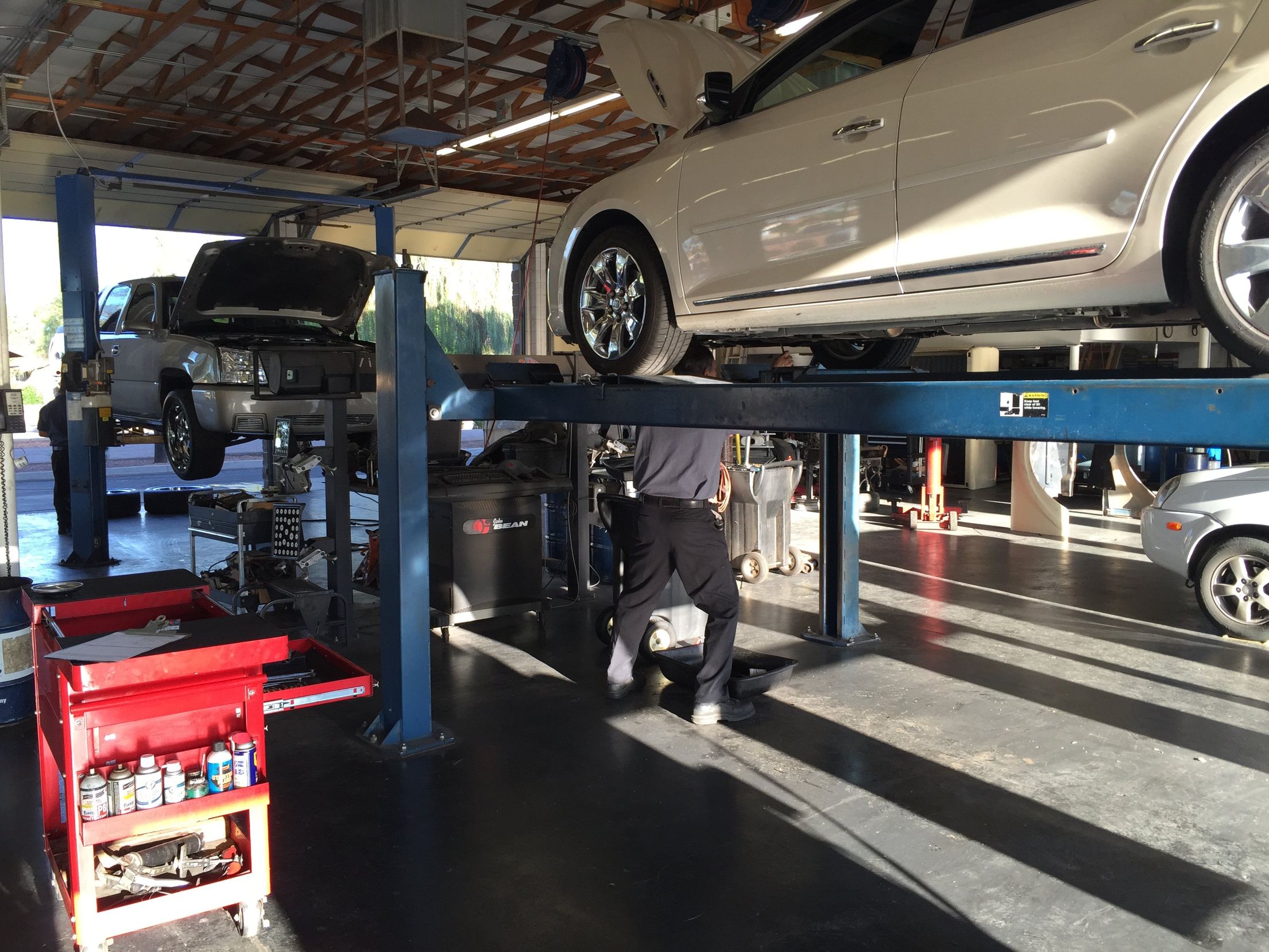 Technician working under a car