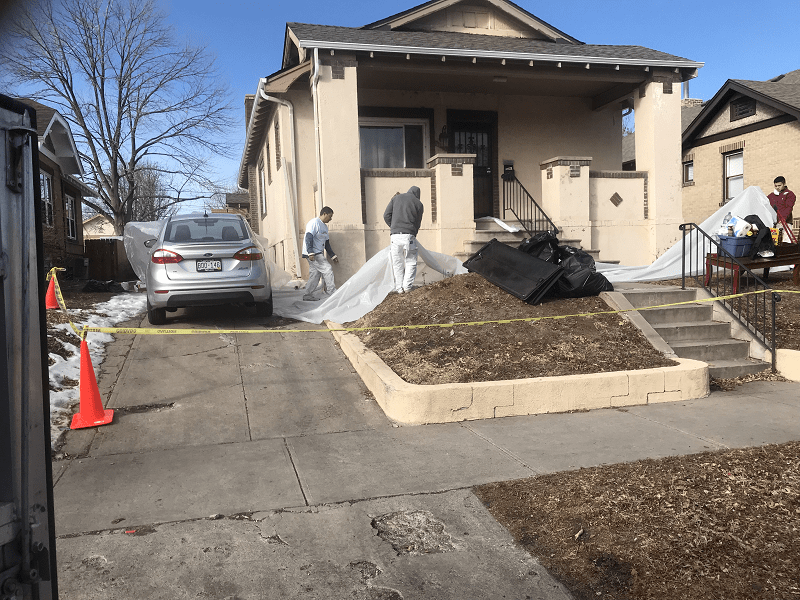 Working on exterior front of house