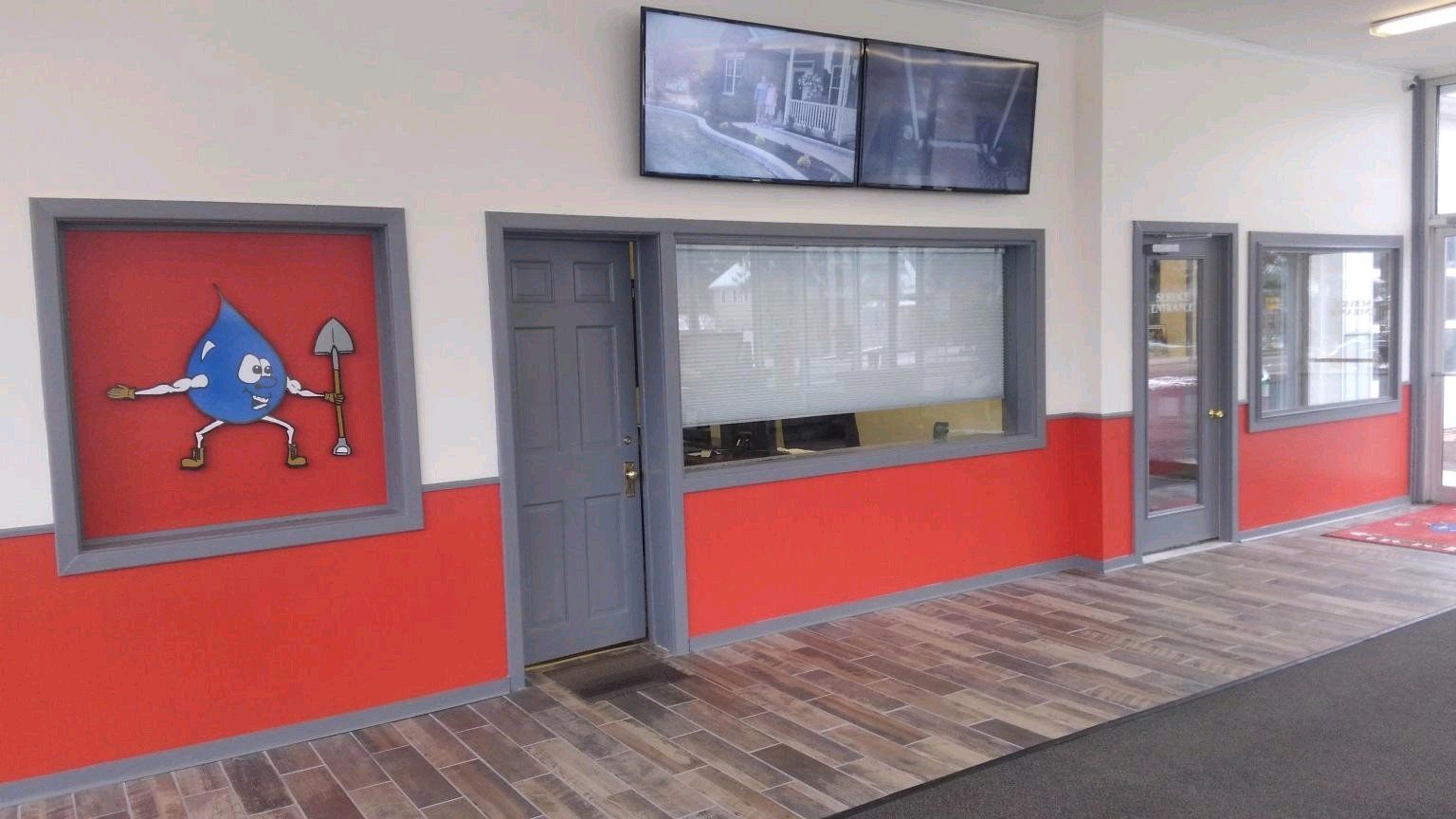 Showroom (featuring large screens with before and after shots)