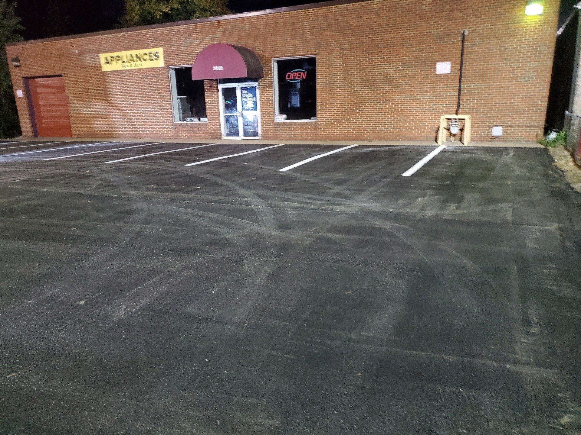 Parking lots area near the appliances building, showing a designated parking area for customers or employees