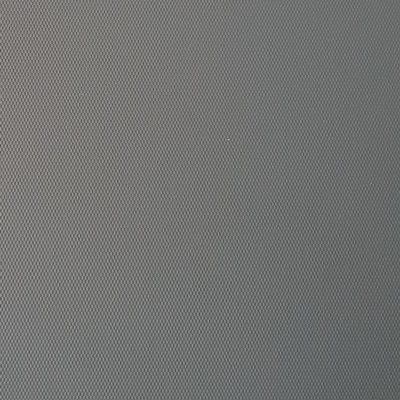 A close up of a gray fabric with holes in it.